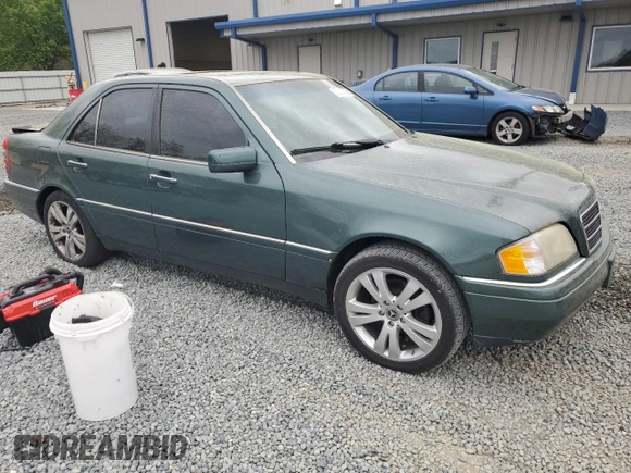 1995 Mercedes-Benz C 230/260/280/320 with VIN WDBHA28E3SF241951, listed as a Copart auction lot 50332845 with 236,068 mi miles and Salvage title. Bid and sale history available at DreamBid. Image 4.