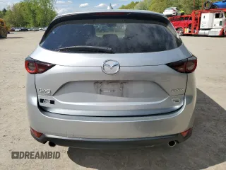 2021 Mazda CX-5 Touring z VIN JM3KFBCM1M0343804, wystawiony jako Copart lot #56194795 z przebiegiem 100 039 mil mil oraz Tytuł czysty. Historia ofert i sprzedaży dostępna na DreamBid. Obrazek 6.