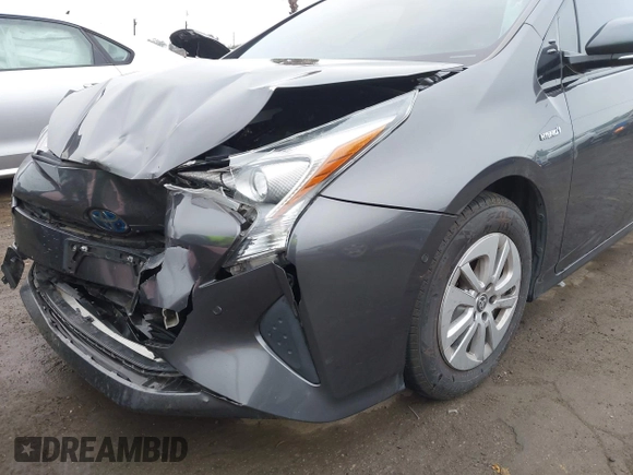 2018 Toyota Prius Two with VIN JTDKBRFUXJ3591956, listed as a IAAI auction lot 41848336 with 62,560 mi miles and . Bid and sale history available at DreamBid. Image 6.