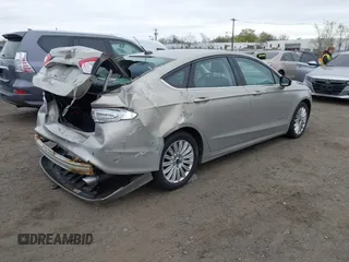 2015 Ford Fusion SE Hybrid with VIN 3FA6P0LU6FR210606, listed as a IAAI auction lot 42070466 with 123,043 mi miles and . Bid and sale history available at DreamBid. Image 4.