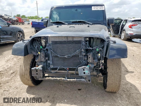 2015 Jeep Wrangler Unlimited Sahara with VIN 1C4BJWEG4FL668339, listed as a Copart auction lot 61221325 with 117,887 mi miles and Salvage title. Bid and sale history available at DreamBid. Image 5.
