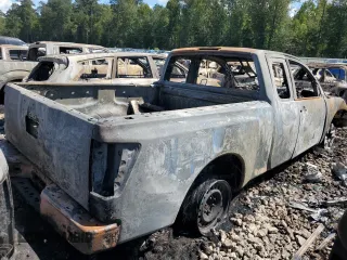 2010 Nissan Titan SE with VIN 1N6BA0CH0AN325143, listed as a Copart auction lot 66860214 with 77,033 mi miles and Salvage Title. Bid and sale history available at carsss.com. Image 3.