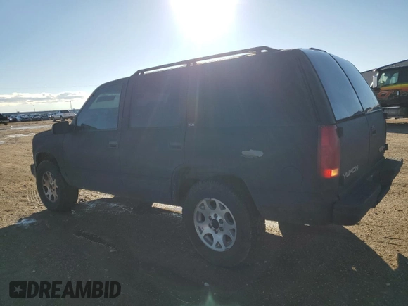 1997 GMC Yukon with VIN 1GKEK13R0VJ710179, listed as a Copart auction lot 81374234 with 186,257 mi miles and Salvage Title. Bid and sale history available at carsss.com. Image 2.