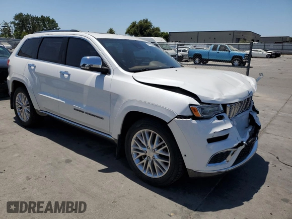 2018 Jeep Grand Cherokee Summit with VIN 1C4RJEJG9JC212554, listed as a Copart auction lot 63123065 with 82,976 mi miles and Salvage title. Bid and sale history available at DreamBid. Image 4.