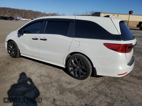2021 Honda Odyssey EX-L with VIN 5FNRL6H78MB019258, listed as a Copart auction lot 52496285 with 33,734 mi miles and Salvage Title. Bid and sale history available at DreamBid. Image 2.