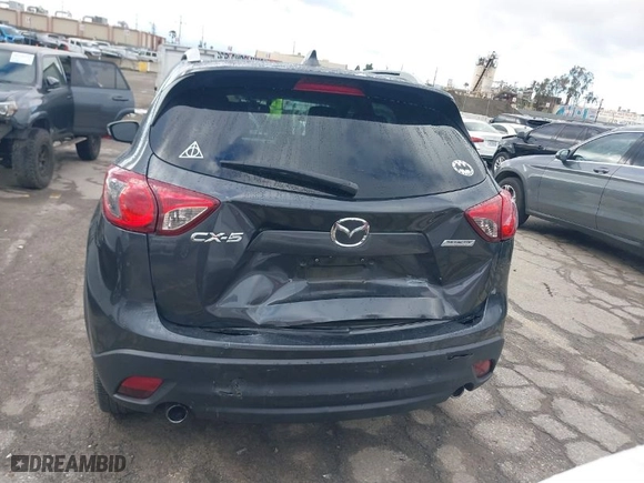 2014 Mazda CX-5 Grand Touring with VIN JM3KE2DY3E0361940, listed as a IAAI auction lot 41708680 with 99,719 mi miles. Bid and sale history available at carsss.com. Image 16.