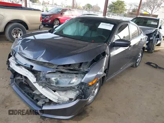 2020 Honda Civic Sedan LX with VIN 2HGFC2F61LH552858, listed as a IAAI auction lot 41554396 with 166,982 mi miles. Bid and sale history available at carsss.com. Image 2.
