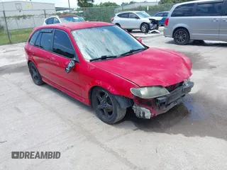 2002 Mazda Protege z VIN JM1BJ245221528868, wystawiony jako IAAI lot #42390388 z przebiegiem 222 006 mil mil oraz . Historia ofert i sprzedaży dostępna na DreamBid. Obrazek 1.