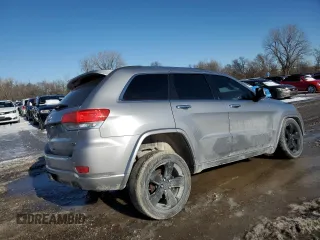 2014 Jeep Grand Cherokee Overland with VIN 1C4RJFCG2EC281062, listed as a Copart auction lot 47099225 with 127,660 mi miles and Salvage Title. Bid and sale history available at carsss.com. Image 3.