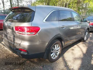 2017 Kia Sorento LX with VIN 5XYPG4A36HG279857, listed as a IAAI auction lot 42115007 with 112,592 mi miles. Bid and sale history available at carsss.com. Image 4.