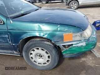 1995 Mercury Sable GS z VIN 1MELM50U8SA632936, wystawiony jako IAAI lot #41695182 z przebiegiem 124 194 mil mil oraz . Historia ofert i sprzedaży dostępna na DreamBid. Obrazek 15.