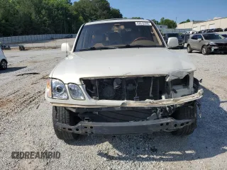 1999 Lexus LX 470 z VIN JT6HT00W1X0074382, wystawiony jako Copart lot #53612205 z przebiegiem 256 689 mil mil oraz Szkoda całkowita • Salvage title. Historia ofert i sprzedaży dostępna na DreamBid. Obrazek 5.