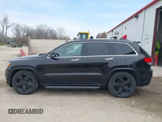 2014 Jeep Grand Cherokee Overland with VIN 1C4RJFCM8EC486259, listed as a IAAI auction lot 42105296 with 129,342 mi miles. Bid and sale history available at carsss.com. Image 14.