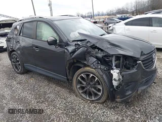 2016 Mazda CX-5 Grand Touring z VIN JM3KE2DY7G0668210, wystawiony jako IAAI lot #41066894 z przebiegiem Nie podano mil oraz . Historia ofert i sprzedaży dostępna na DreamBid. Obrazek 1.