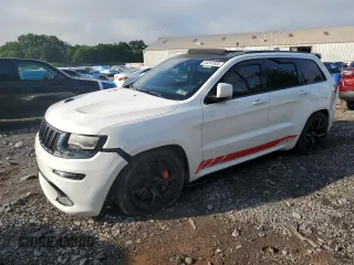 2016 Jeep Grand Cherokee SRT with VIN 1C4RJFDJ6GC378116, listed as a Copart auction lot 64297635 with 128,628 mi miles and Salvage title. Bid and sale history available at DreamBid. Image 1.