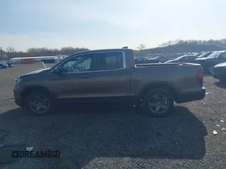 2022 Honda Ridgeline RTL z VIN 5FPYK3F51NB038239, wystawiony jako IAAI lot #41937070 z przebiegiem 39 012 mil mil oraz . Historia ofert i sprzedaży dostępna na DreamBid. Obrazek 14.