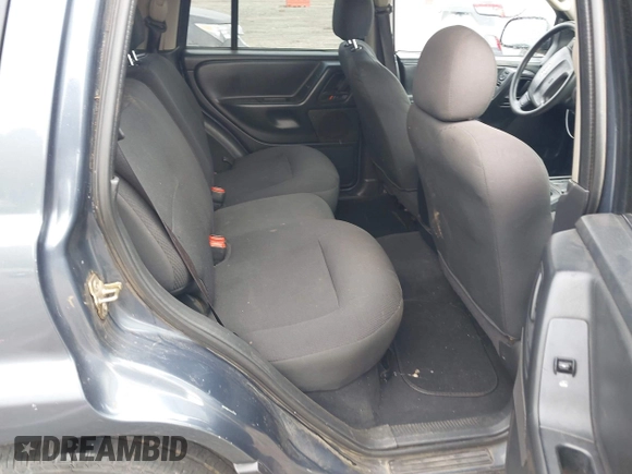2002 Jeep Grand Cherokee Laredo z VIN 1J4GX48S62C201579, wystawiony jako IAAI lot #42102238 z przebiegiem 262 630 mil mil oraz . Historia ofert i sprzedaży dostępna na DreamBid. Obrazek 8.