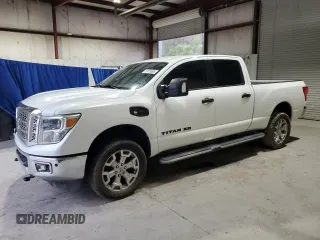 2016 Nissan Titan Platinum Reserve z VIN 1N6BA1F27GN502647, wystawiony jako Copart lot #53079895 z przebiegiem 143 384 mil mil oraz Tytuł czysty. Historia ofert i sprzedaży dostępna na DreamBid. Obrazek 1.