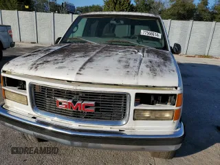 1999 GMC Suburban z VIN 3GKFK16RXXG503321, wystawiony jako Copart lot #77568614 z przebiegiem Nie podano mil oraz Tytuł czysty. Historia ofert i sprzedaży dostępna na DreamBid. Obrazek 11.