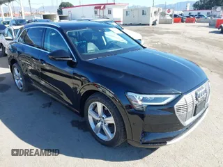 2019 Audi e-tron Premium Plus with VIN WA1LAAGE9KB021724, listed as a IAAI auction lot 41643596 with 34,804 mi miles. Bid and sale history available at carsss.com. Image 1.