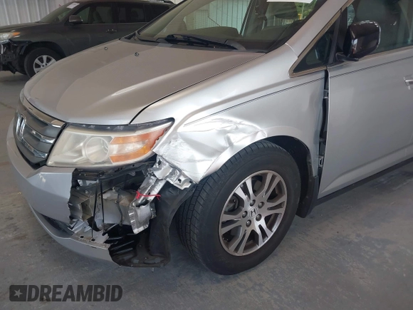 2012 Honda Odyssey EX-L with VIN 5FNRL5H67CB005013, listed as a IAAI auction lot 42295586 with 200,611 mi miles and . Bid and sale history available at DreamBid. Image 6.