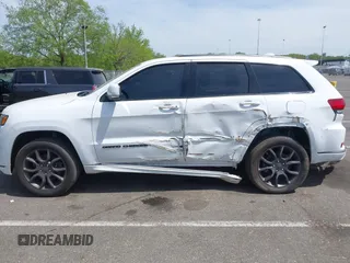 2021 Jeep Grand Cherokee Overland with VIN 1C4RJFCG6MC592296, listed as a IAAI auction lot 42170899 with 56,553 mi miles and . Bid and sale history available at DreamBid. Image 14.