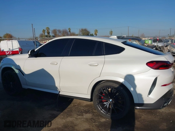 2021 BMW X6 sDrive40i z VIN 5UXCY4C06M9E16162, wystawiony jako IAAI lot #41279040 z przebiegiem 94 494 mil mil oraz . Historia ofert i sprzedaży dostępna na DreamBid. Obrazek 14.