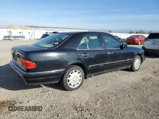 1997 Mercedes-Benz E-Class with VIN WDBJF55F5VJ028552, listed as a Copart auction lot 84172054 with 308,426 mi miles and Clean Title. Bid and sale history available at carsss.com. Image 3.