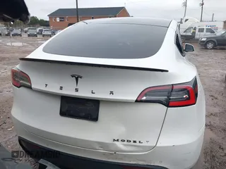2021 Tesla Model Y Standard Range with VIN 5YJYGDED8MF114076, listed as a IAAI auction lot 41567295 with 150,133 mi miles and . Bid and sale history available at DreamBid. Image 15.