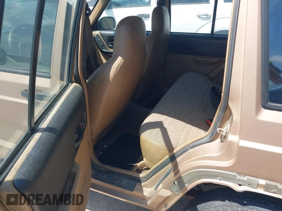1999 Jeep Cherokee Sport with VIN 1J4FT68S1XL528885, listed as a IAAI auction lot 42536873 with Not provided miles and . Bid and sale history available at DreamBid. Image 8.