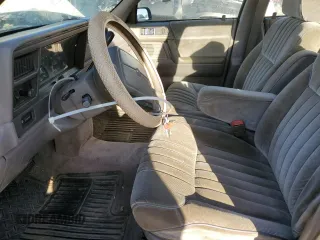 1991 Dodge Spirit z VIN 1B3XA5639MF549470, wystawiony jako Copart lot #76051284 z przebiegiem 62 309 mil mil oraz Szkody całkowita. Historia ofert i sprzedaży dostępna na DreamBid. Obrazek 7.
