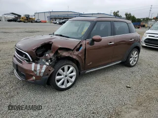 2015 MINI Countryman S z VIN WMWZC5C52FWP48478, wystawiony jako Copart lot #59591555 z przebiegiem 55 818 mil mil oraz Szkoda całkowita • Salvage title. Historia ofert i sprzedaży dostępna na DreamBid. Obrazek 1.