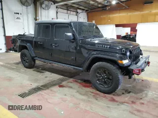 2021 Jeep Gladiator Willys with VIN 1C6HJTAG4ML556255, listed as a Copart auction lot 57143125 with 57,104 mi miles and Salvage title. Bid and sale history available at DreamBid. Image 4.