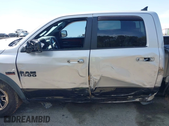 2015 Ram 1500 Rebel z VIN 1C6RR7YT0FS751334, wystawiony jako IAAI lot #41933040 z przebiegiem 167 336 mil mil oraz . Historia ofert i sprzedaży dostępna na DreamBid. Obrazek 15.