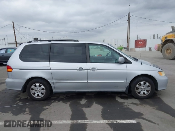 2003 Honda Odyssey EX-L with VIN 5FNRL18943B030373, listed as a IAAI auction lot 41867289 with 179,718 mi miles and . Bid and sale history available at DreamBid. Image 13.