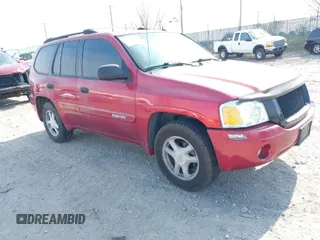 2004 GMC Envoy SLE with VIN 1GKDT13S442157704, listed as a IAAI auction lot 41907592 with 127,000 mi miles. Bid and sale history available at carsss.com. Image 1.