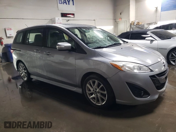 2015 Mazda 5 Grand Touring with VIN JM1CW2DL9F0181734, listed as a Copart auction lot 85604134 with 136,917 mi miles and Salvage title. Bid and sale history available at DreamBid. Image 4.