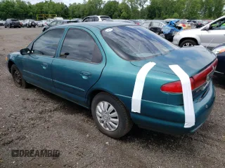 1996 Mercury Mystique z VIN 3MELM6530TM601366, wystawiony jako Copart lot #74239734 z przebiegiem 90 989 mil mil oraz Nie do naprawy. Historia ofert i sprzedaży dostępna na DreamBid. Obrazek 2.