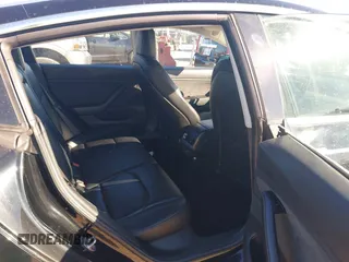 2018 Tesla Model 3 Long Range Battery with VIN 5YJ3E1EA2JF014975, listed as a IAAI auction lot 41319407 with 106,301 mi miles and . Bid and sale history available at DreamBid. Image 8.