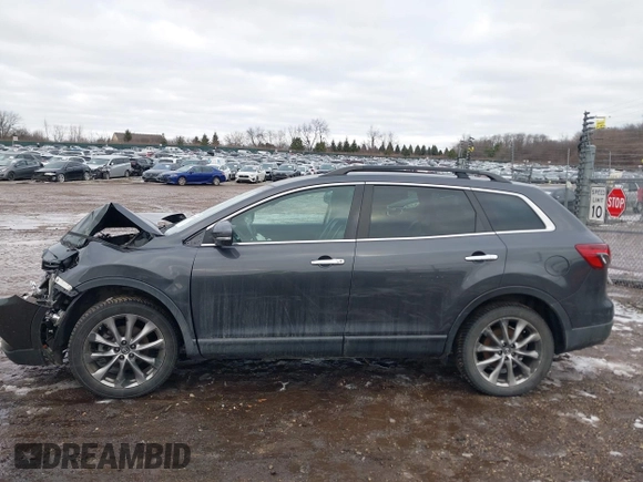 2015 Mazda CX-9 Grand Touring with VIN JM3TB2DAXF0447537, listed as a IAAI auction lot 41191694 with 157,113 mi miles. Bid and sale history available at carsss.com. Image 14.