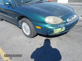 1999 Mercury Sable LS z VIN 1MEFM53S7XA612899, wystawiony jako IAAI lot #41687188 z przebiegiem 155 128 mil mil oraz . Historia ofert i sprzedaży dostępna na DreamBid. Obrazek 13.