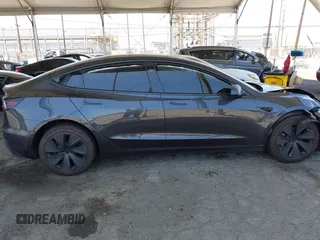 2025 Tesla Model 3 Long Range with VIN 5YJ3E1EA5SF978214, listed as a IAAI auction lot 42525444 with 6,489 mi miles and . Bid and sale history available at DreamBid. Image 14.