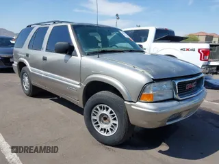 1999 GMC Jimmy SLE with VIN 1GKDT13W5X2539067, listed as a IAAI auction lot 41979222 with 1 mi miles. Bid and sale history available at carsss.com. Image 1.