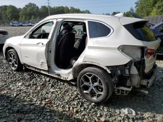 2017 BMW X1 xDrive28i with VIN WBXHT3C33H5F70208, listed as a Copart auction lot 67999764 with 130,341 mi miles and Salvage Title. Bid and sale history available at carsss.com. Image 2.
