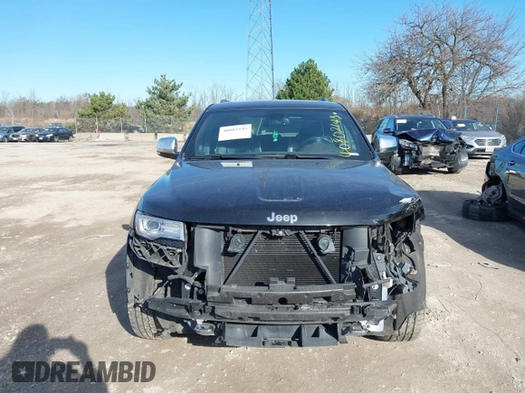 2014 Jeep Grand Cherokee Overland with VIN 1C4RJECG4EC523747, listed as a IAAI auction lot 40802143 with 124,079 mi miles. Bid and sale history available at carsss.com. Image 12.