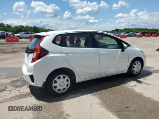 2015 Honda Fit LX z VIN 3HGGK5H59FM760585, wystawiony jako Copart lot #55737365 z przebiegiem 79 700 mil mil oraz Szkoda całkowita • Salvage title. Historia ofert i sprzedaży dostępna na DreamBid. Obrazek 3.