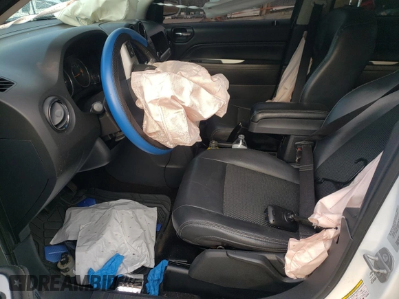 2015 Jeep Compass Latitude with VIN 1C4NJCEB9FD264284, listed as a Copart auction lot 76277334 with 104,275 mi miles and Salvage Title. Bid and sale history available at carsss.com. Image 7.
