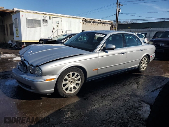 2004 Jaguar XJ with VIN SAJEA71C04SG04022, listed as a Copart auction lot 45875105 with 153,453 mi miles and Salvage Title. Bid and sale history available at carsss.com. Image 1.