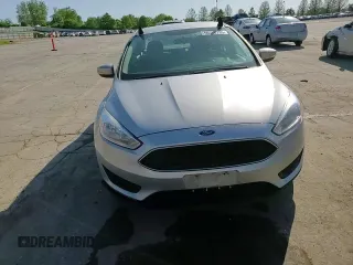 2017 Ford Focus SE z VIN 1FADP3F29HL339332, wystawiony jako Copart lot #56556735 z przebiegiem 93 050 mil mil oraz Szkoda całkowita • Salvage title. Historia ofert i sprzedaży dostępna na DreamBid. Obrazek 13.