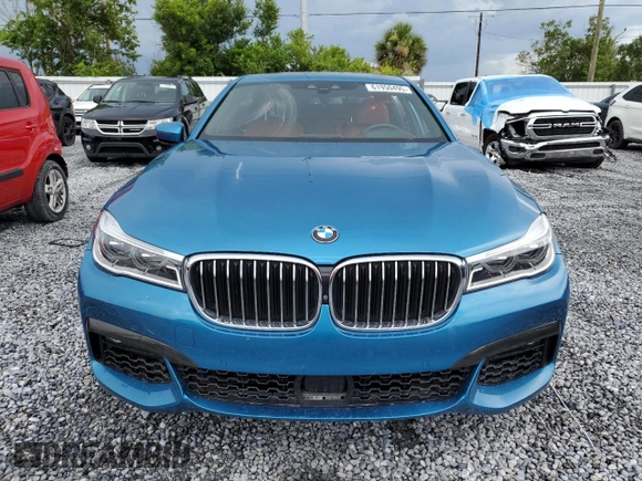 2019 BMW 7 Series 750i z VIN WBA7F0C51KGM25707, wystawiony jako Copart lot #61950495 z przebiegiem 56 768 mil mil oraz Nie do naprawy • Non repairable. Historia ofert i sprzedaży dostępna na DreamBid. Obrazek 5.